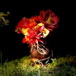 Small fall flower arrangement in wooden vase